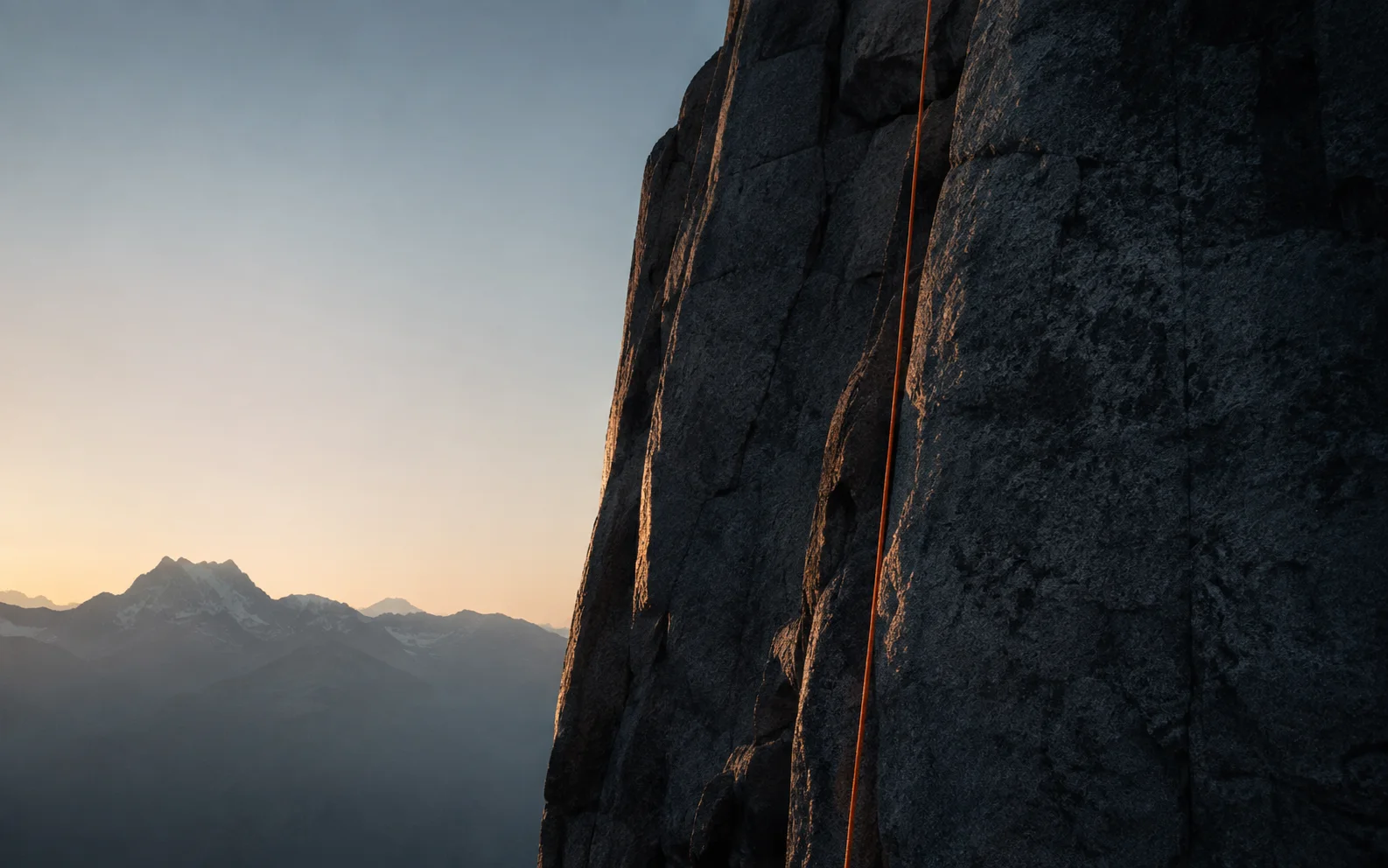 Granite climbing face crossed by a HAUTR rope